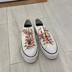 White platform low top converse with rainbow accents
